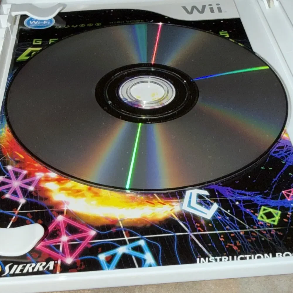 Sierra Geometry Wars: Galaxies (Nintendo Wii) Complete Manual, Multiplayer E